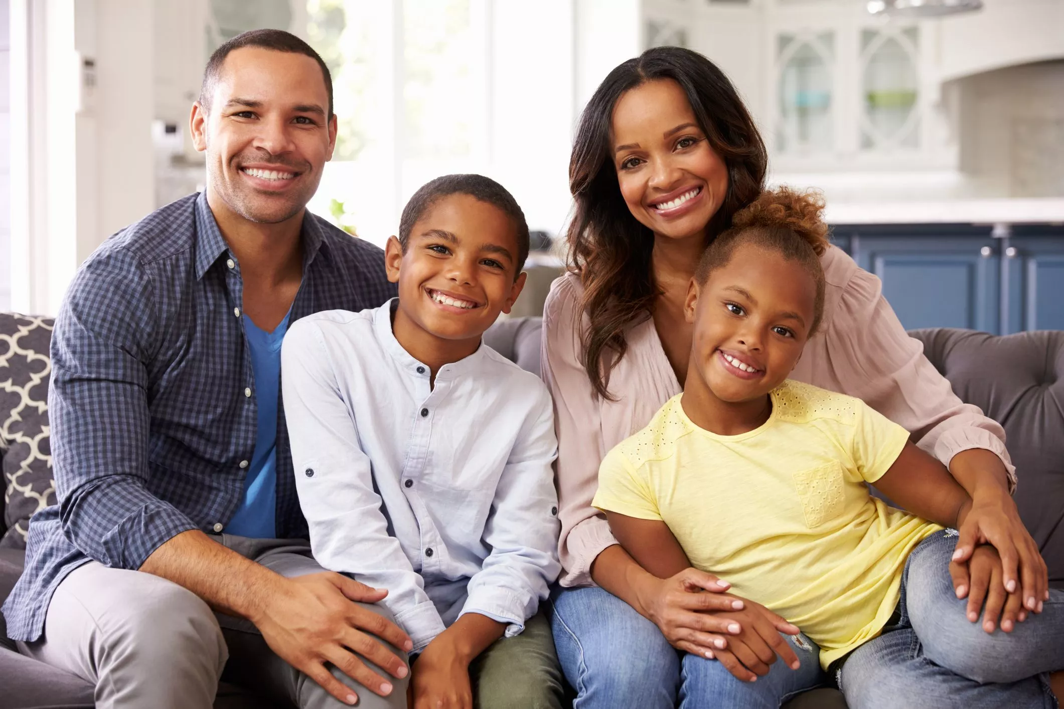 Smiling family secured with life and health insurance plans in Maryland